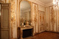 Gold filigree decorating walls in Salon de Compagnie of Uzès Hotel at Carnavalet Museum. Paris, France.