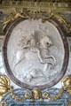 Detail of Victorious Louis XIV Crowned by Glory relief sculpture by Antoine Coysevox in War Room at Versailles Palace. Versailles, France.
