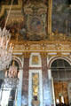 Gilded marble walls & chandeliers in Hall of Mirrors at Versailles Palace. Versailles, France.