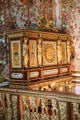Cabinet with elaborate carvings in Queen's Bedroom at Versailles Palace. Versailles, France.