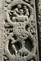 Carving of wine barrel & man with pigs on exterior of St-Denis Basilica. St Denis, France.