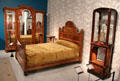 Art Nouveau bedroom furniture by Émile Gallé: Showcase with forest design marquetry; bed with dahlias marquetry at Museum of Fine Arts. Reims, France.
