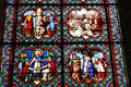 Stained glass window with scenes from life of St Louis in Notre Dame Cathedral. Senlis, France.