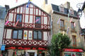 Street festooned with decorative fish in historic center. Auray, France.