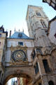 Great Clock archway & clock face beside belfry tower. Rouen, France