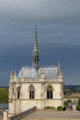 View of St Hubert's Chapel against darkening sky at Chateau Royal of Amboise. Amboise, France.