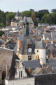 Clock tower & St Denis church among roofs of old town. Amboise, France.