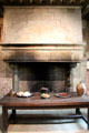 Fireplace & Renaissance table in kitchen at Château de Clos Lucé. Amboise, France.