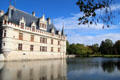 Château d'Azay-le-Rideau with aligned windows & dormer windows looking onto Indre River. Azay-le-Rideau, France