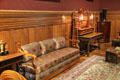 Sofa with wooden frame & ornate upholstery in Billiards Room at Château d'Azay-le-Rideau. Azay-le-Rideau, France.
