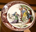 Joan of Arc in Bois Chesnu on porcelain plate By Sarreguemines Factory in Royal Lodgings museum at Château de Chinon. Chinon, France.