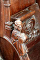 Carved monk with barrel detail on choir stall in Chapel at Chateau D'Ussé. Ussé, France.