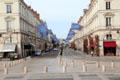 Street scene down rue Jeanne d'Arc from Place St Croix. France.