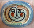 Ceramic plate with face on blue background by Pablo Picasso at Picasso Museum. Antibes, France.