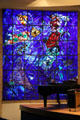 One of three stained glass windows depicting creation by Marc Chagall in auditorium at Chagall Museum. Nice, France.