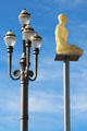 Ornate light fixture & sculpture on platform along Promenade du Paillon. Nice, France.