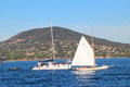 Sailboat & yacht with Sainte-Maxime in the background. St Tropez, France.