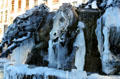 Bartholdi fountain detail with icicles. Lyon, France.