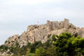 Les Baux castle blends with rock face which supports it. Les Baux, France