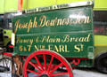 Horse-drawn two-wheeled door-to-door bread delivery van for Joseph Downes & Son Ltd. at National Transport Museum. Howth, Ireland.