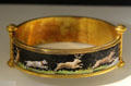 Gold bracelet with micro-mosaic scene of dog chasing deer at National Museum Decorative Arts & History. Dublin, Ireland.