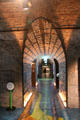 Vaults of customs warehouse lighted to transform them to museum display of Irish Emigration Museum. Dublin, Ireland.