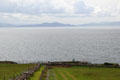 Dingle Bay view with ruins of Dunbeg iron age fort on loop road around Dingle Peninsula. Ireland.