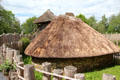 Replica of Ringfort with thatched roofs at Irish National Heritage Park. Ireland.