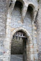 Portcullis with projecting stonework overhang used to support mechanism to raise the defensive door at Cahir Castle. Cahir, Ireland