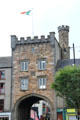NeoGothic building with arch over O'Connell Street. Clonmel, Ireland.