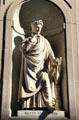 Statue of Dante Allighieri in exterior niche of Uffizi Gallery. Florence, Italy.