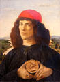 Portrait of a young man with a medal painting by Sandro Botticelli at Uffizi Gallery. Florence, Italy.