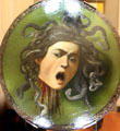Head of Medusa parade shield by Caravaggio at Uffizi Gallery. Florence, Italy.