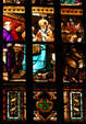 Holy clergy in stained-glass of Duomo. Milan, Italy.