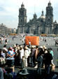 Food lines on Mexico City Zócalo square with Cathedral in distance. Mexico City, Mexico.