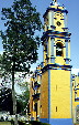 Yellow & blue stucco colors a church in Cholula. Mexico.