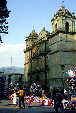Visitors & merchants in front of Cathedral in Oaxaca. Mexico.