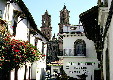 View of street looking towards church in Taxco. Mexico.