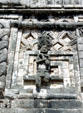 One of native carved sculptures on a building in Nunnery Quadrangle at Uxmal. Mexico.