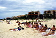Tourists sunbathe on beach in Cancún. Mexico