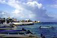 Buildings & boats docked on shore of Cozumel. Mexico.