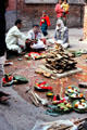 Couple makes an elaborate offering at Kumbeshvara Mandir in Patan , Katmandu. Nepal.