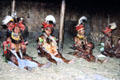 Seated women participating in a courtship ritual near Banz. Papua New Guinea.