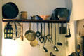 Kitchen utensils including bannock rack with waved grate at Gladstone's Land tenement house. Edinburgh, Scotland.
