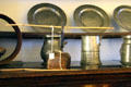 Taper holder in front of pewter plates & flasks at Gladstone's Land tenement house. Edinburgh, Scotland.