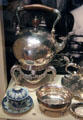 Silver tea service by James Ker of Edinburgh plus lidded porcelain tea cup at National Museum of Scotland. Edinburgh, Scotland.