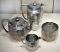 Silver tea set with signs of zodiac by J. Reid of Glasgow plus hot water jug added by W.W. Logan at National Museum of Scotland. Edinburgh, Scotland.