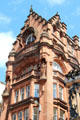 Red sandstone commercial building with sculptures. Glasgow, Scotland.