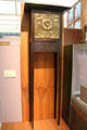 Glasgow-style Art Nouveau tall clock with brass face by Margaret Thomson Wilson at Kelvingrove Art Gallery. Glasgow, Scotland.