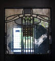 Hall stained glass window in style of Charles Rennie Mackintosh at House for an Art Lover. Glasgow, Scotland.